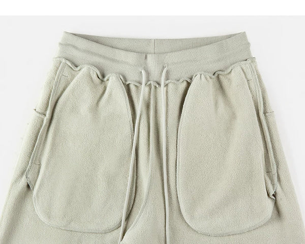 IDLT sweatpants, sage green inner pockets.