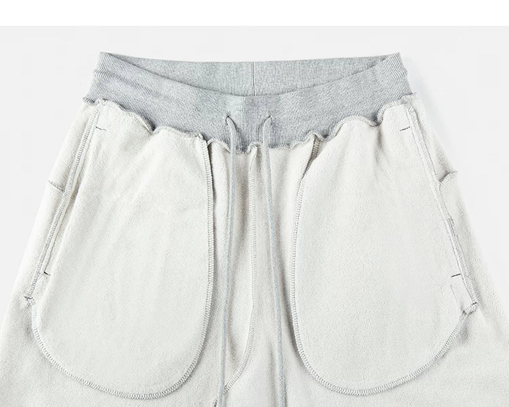 IDLT sweatpants, heather gray inner pockets.