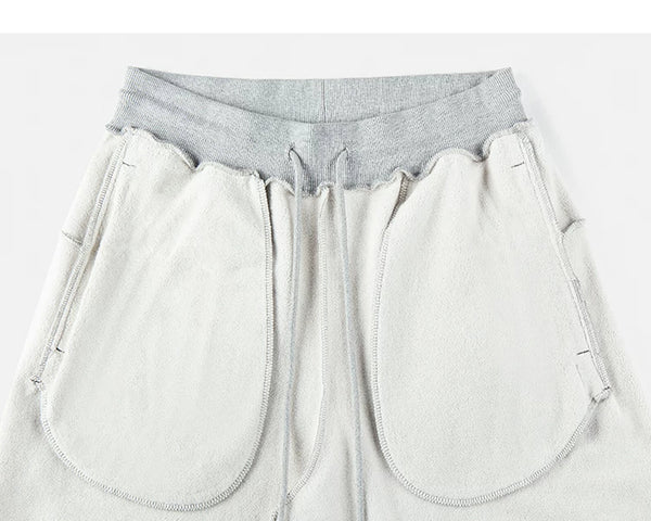 IDLT sweatpants, heather gray inner pockets.