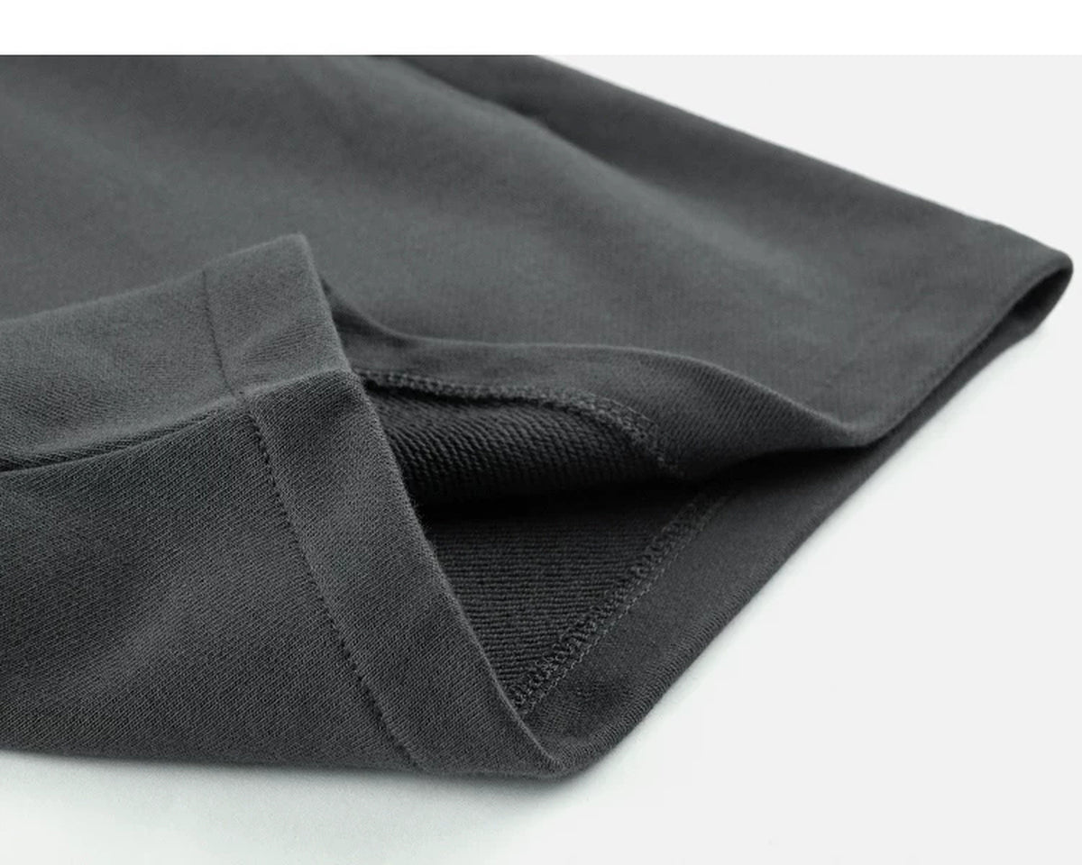 IDLT sweat shorts, dark gray folded hem.
