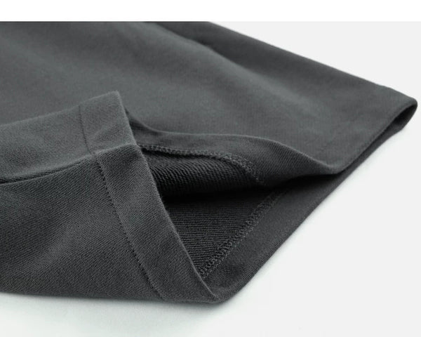 IDLT sweat shorts, dark gray folded hem.