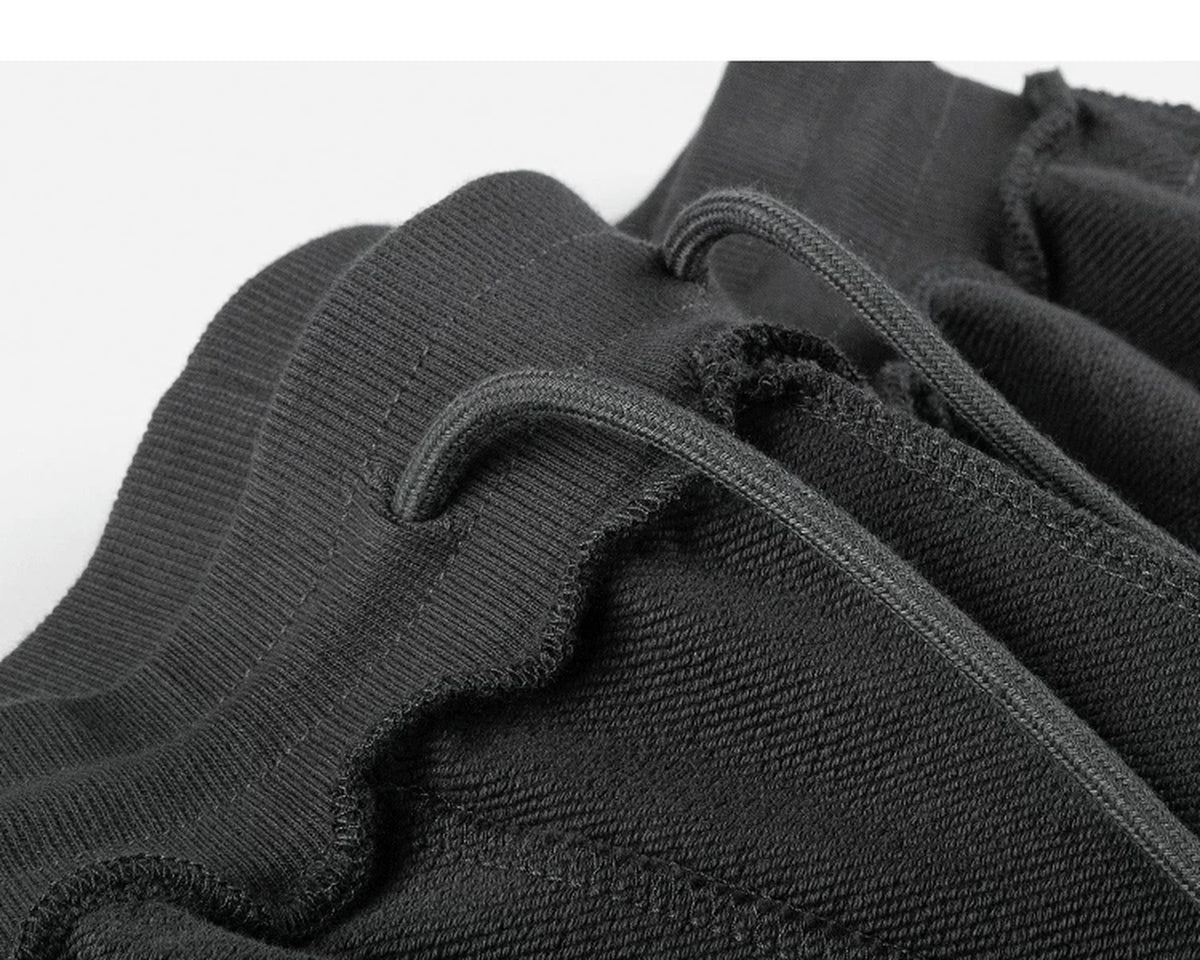 IDLT sweat shorts, dark gray inner waistband stitching.