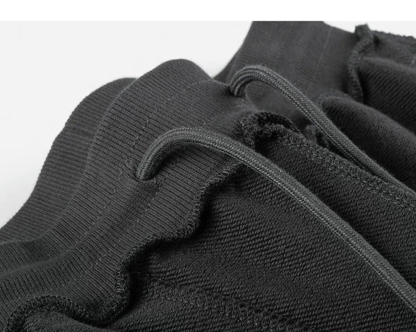 IDLT sweat shorts, dark gray inner waistband stitching.