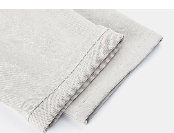 IDLT sweatpants, cream leg hems.