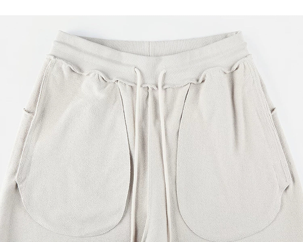 IDLT sweatpants, cream inner pockets.