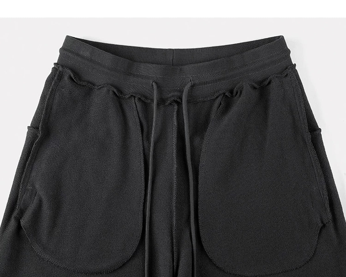 IDLT sweatpants, black inner pockets.