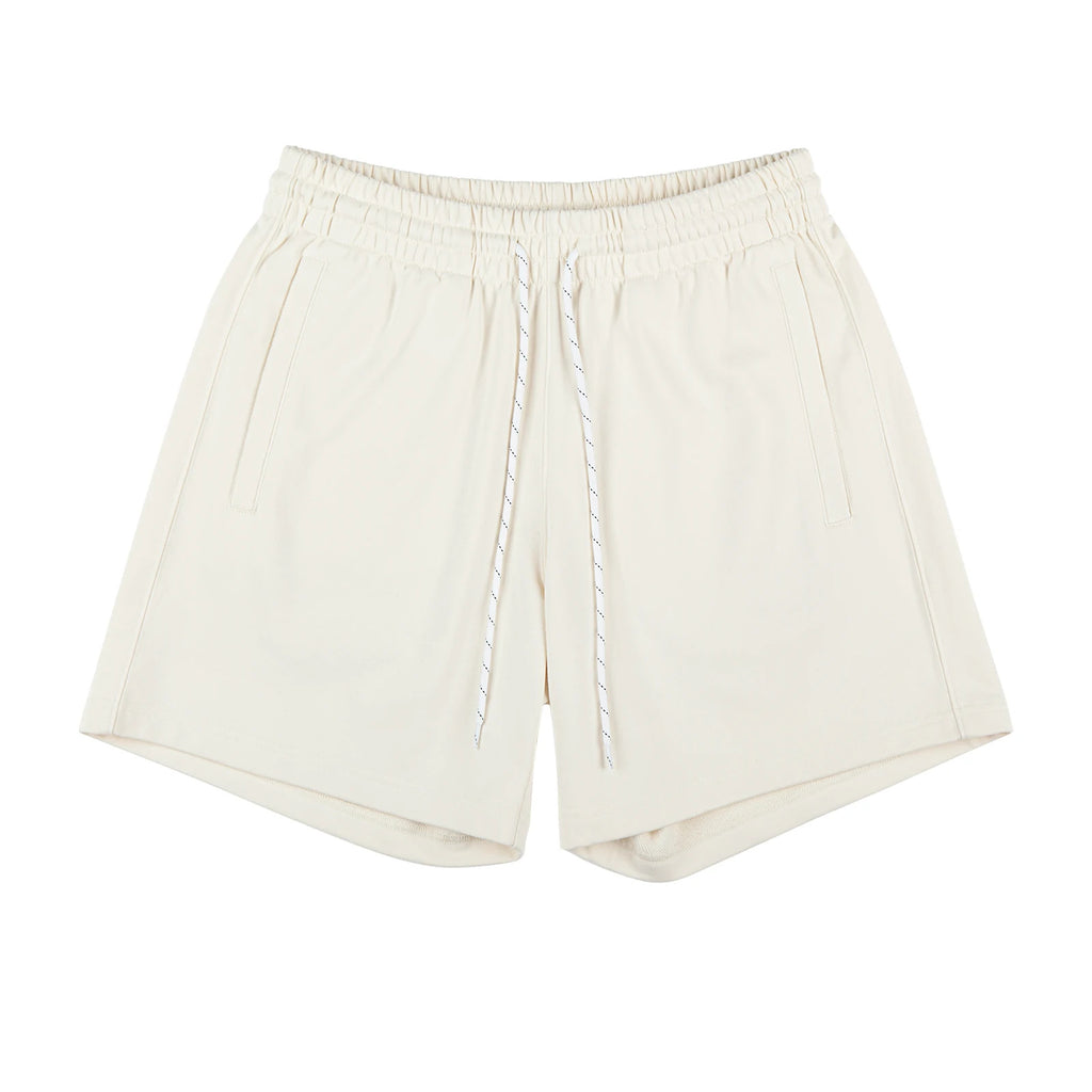 IDLT sweat shorts, cream front.