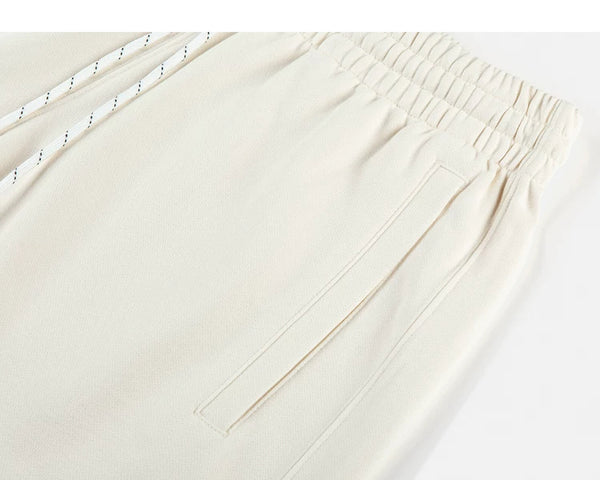 IDLT sweat shorts, cream side pocket.