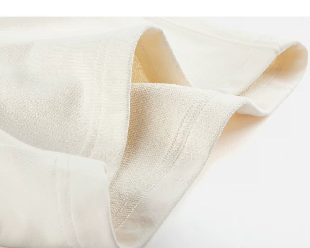 IDLT sweat shorts, cream folded hem.