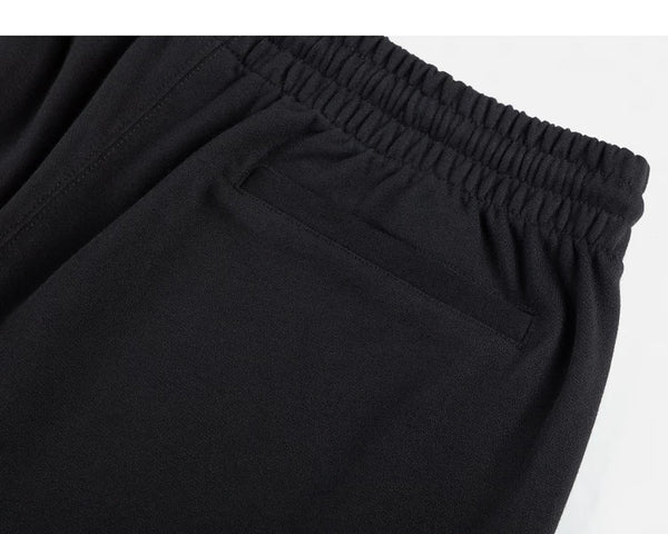 IDLT sweat shorts, black back pocket.