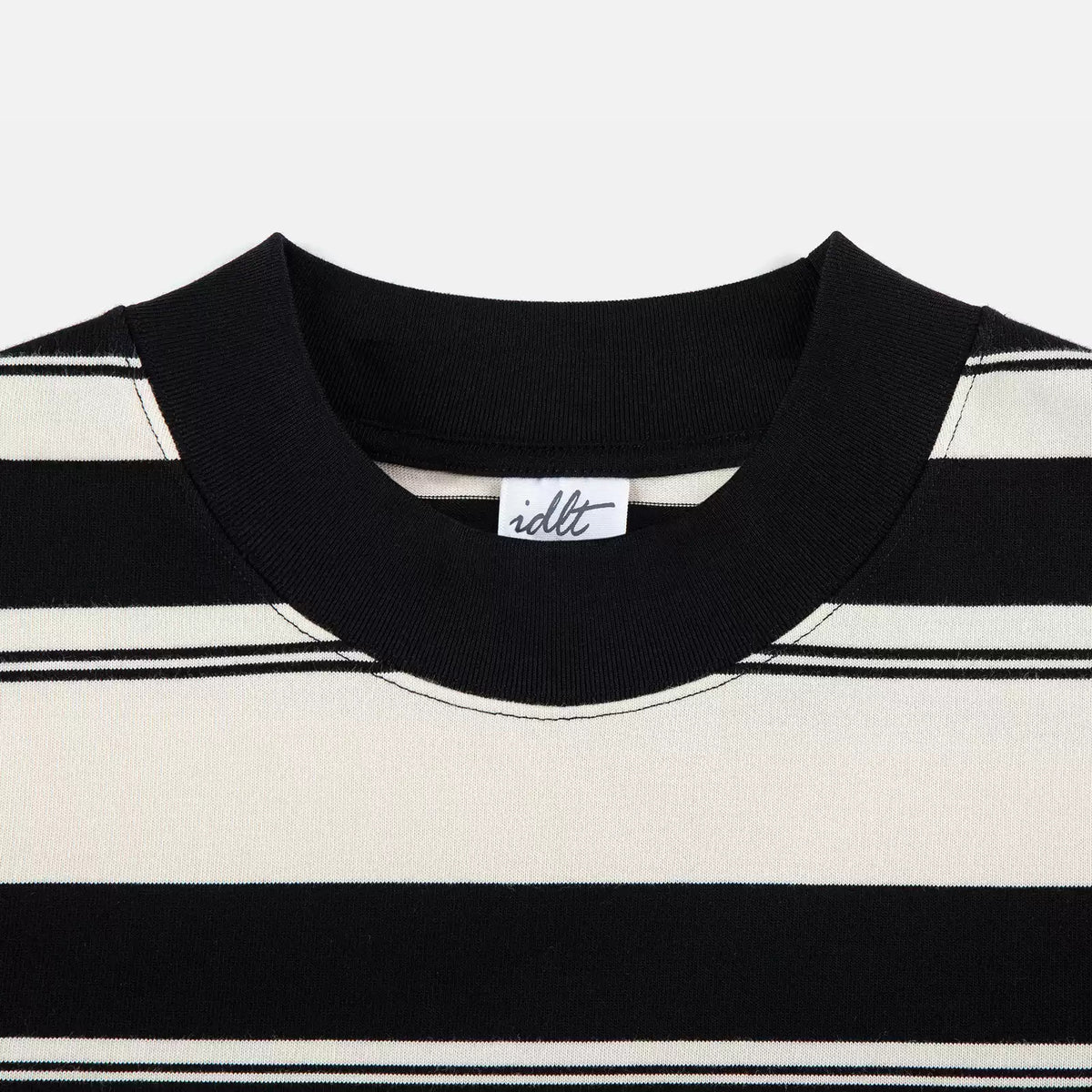 IDLT striped T-shirt, black collar close-up.