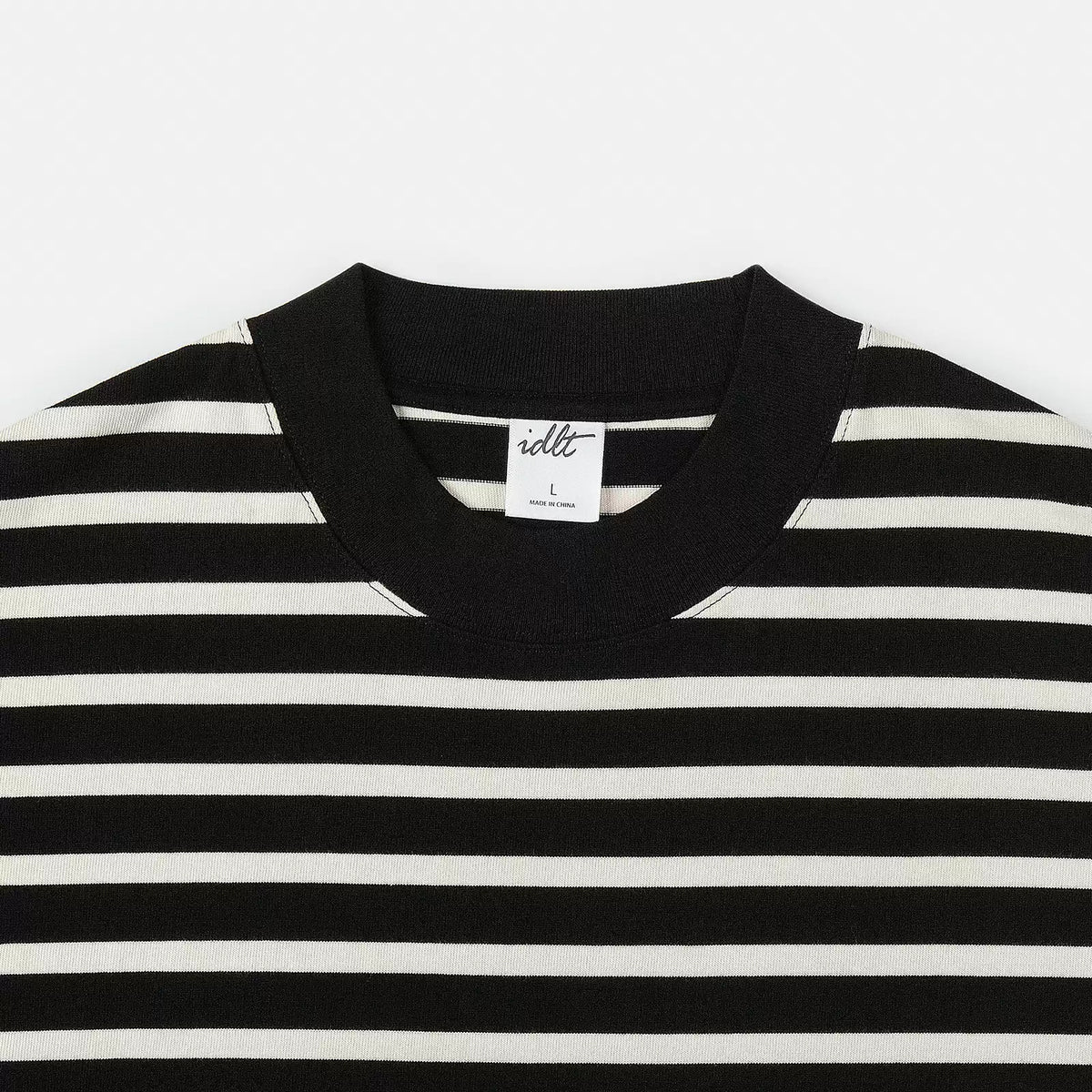 IDLT striped T-shirt, black collar close-up.