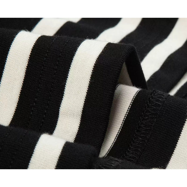 IDLT striped T-shirt, black and cream fabric folds close-up.