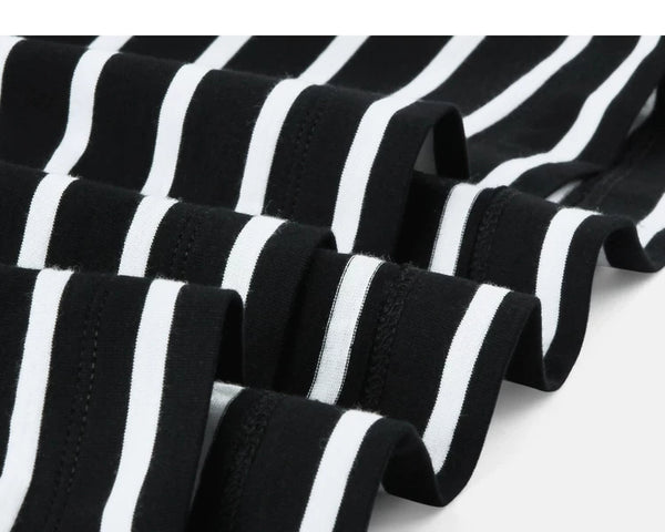IDLT striped T-shirt, black fabric folds.