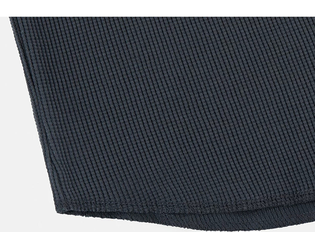 IDLT waffle henley, dark gray hem stitching.