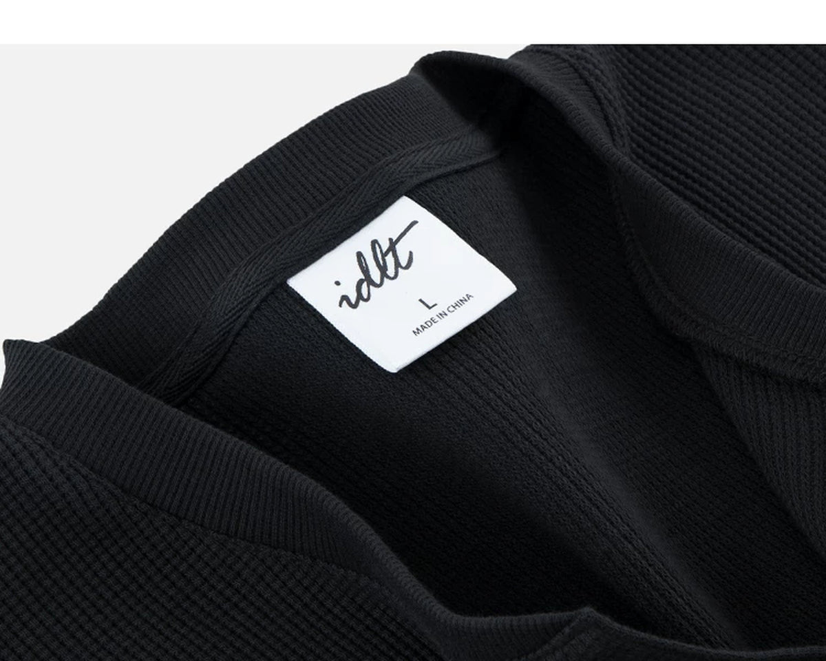 IDLT waffle henley, black neckline label.