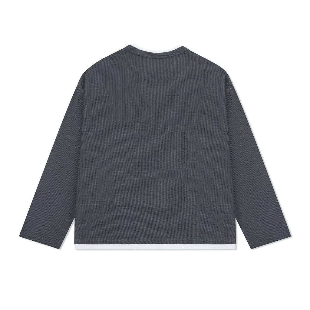 IDLT layered look waffle top, dark gray back laid flat.