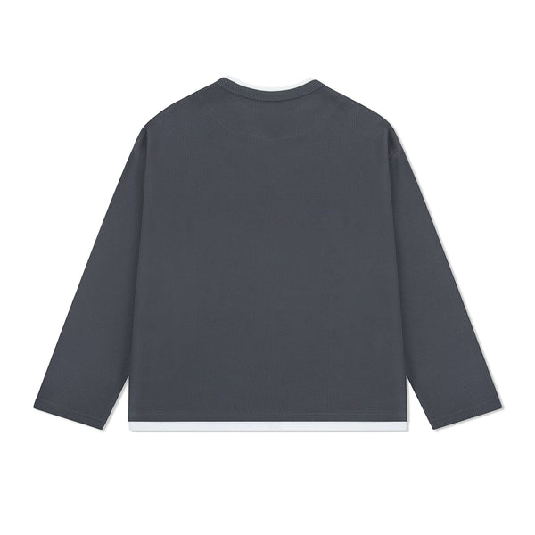 IDLT layered look waffle top, dark gray back laid flat.