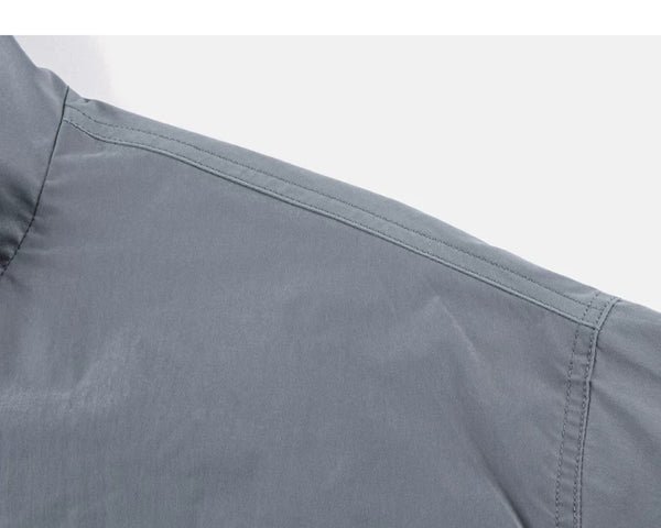 IDLT zip jacket, gray shoulder seam.