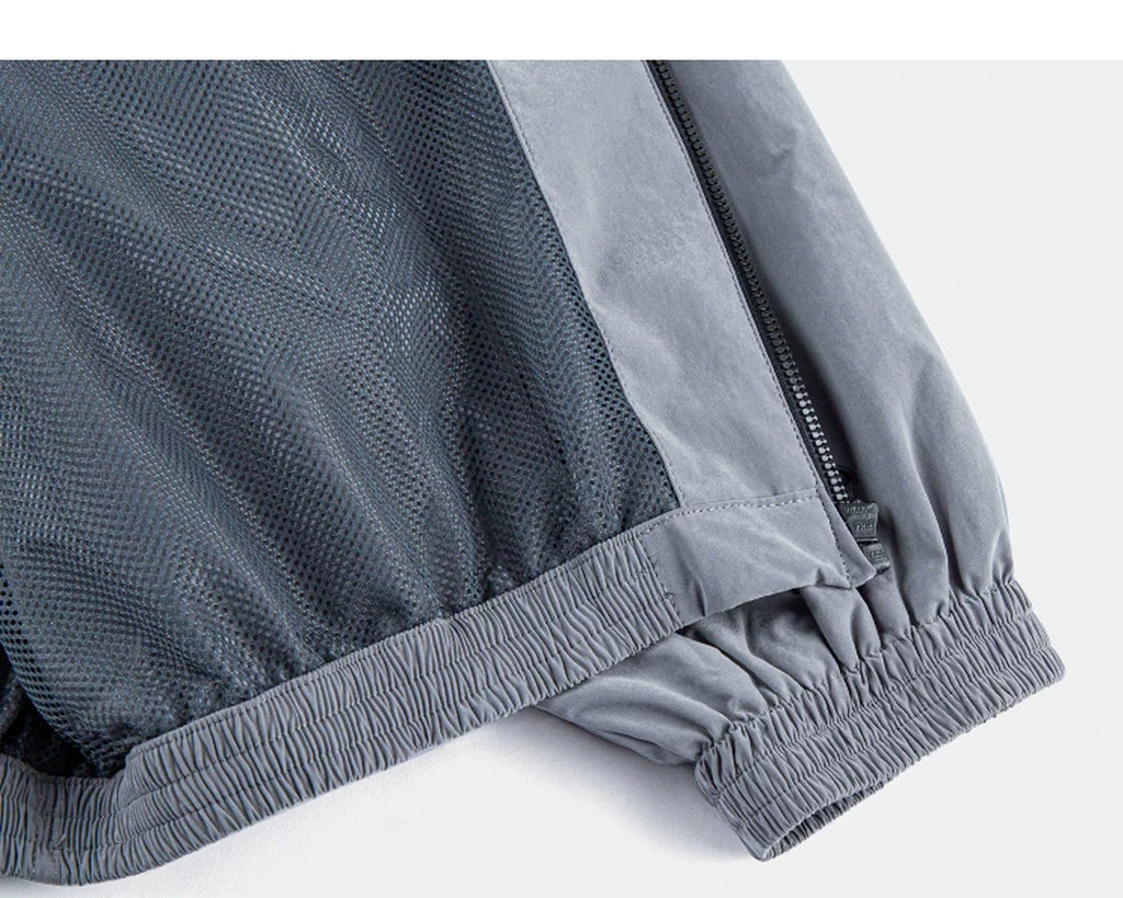IDLT zip jacket, gray inner hem and zipper.
