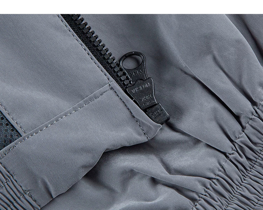 IDLT zip jacket, gray zipper pull.