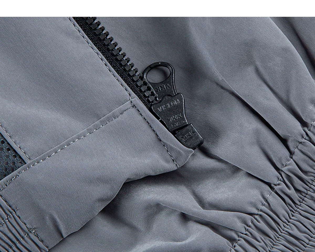 IDLT zip jacket, gray zipper pull.