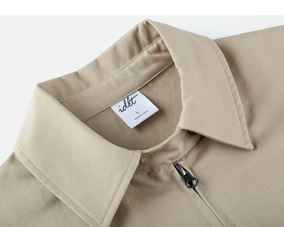 IDLT zip jacket, beige angled neckline label.