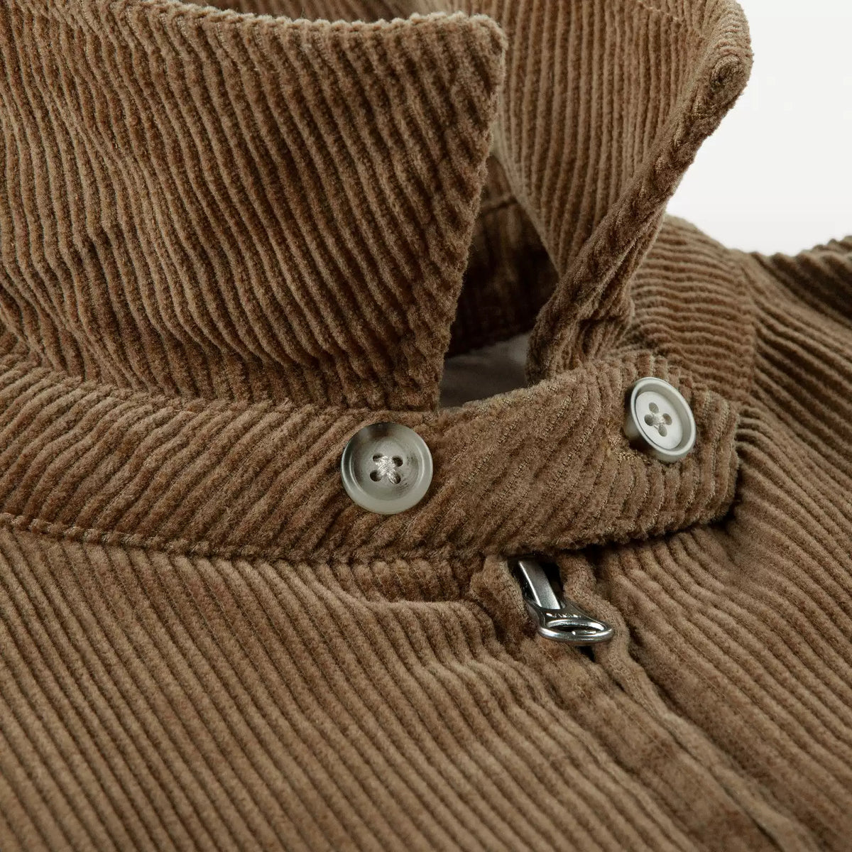 IDLT corduroy jacket, brown collar fastening tab.