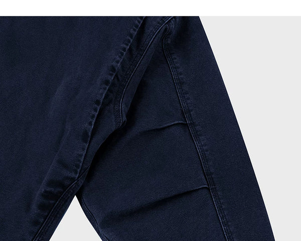 IDLT work jacket, navy underarm seam.
