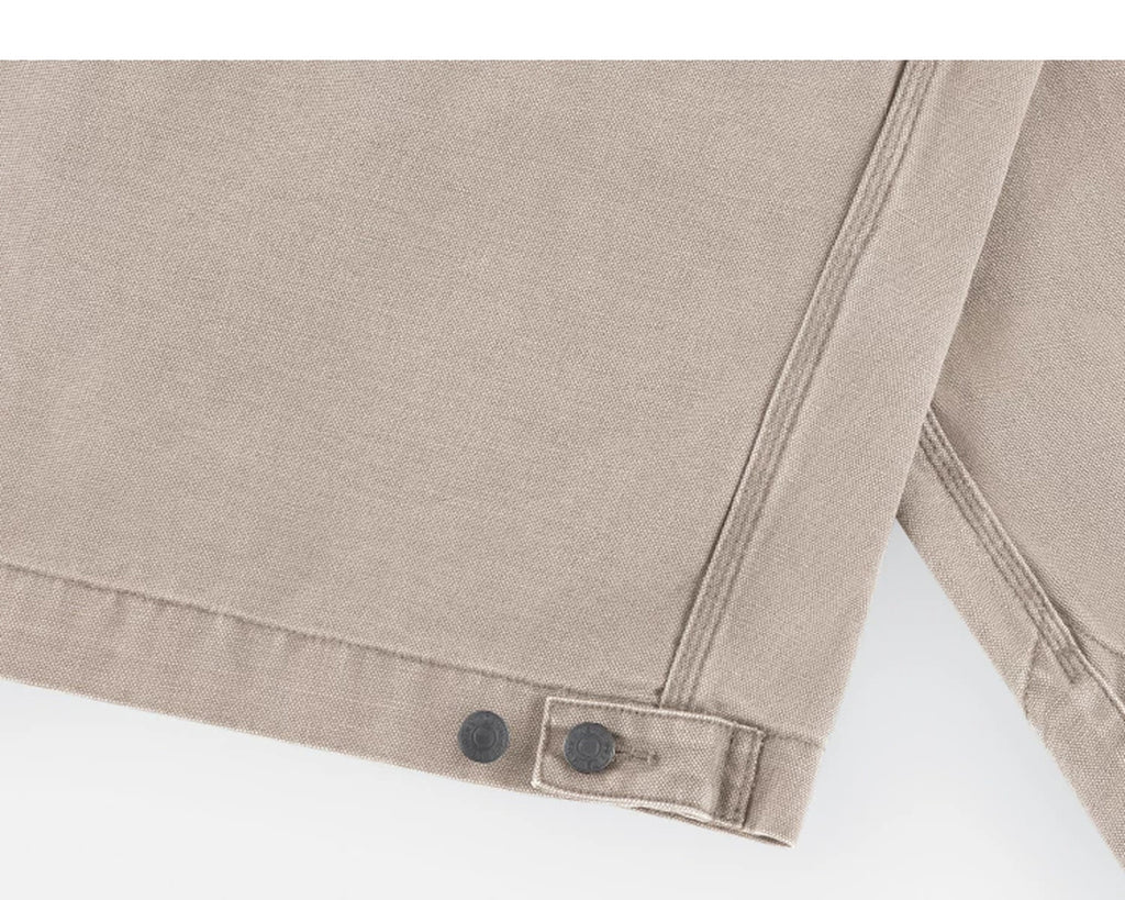 IDLT work jacket, beige hem adjustment tab.