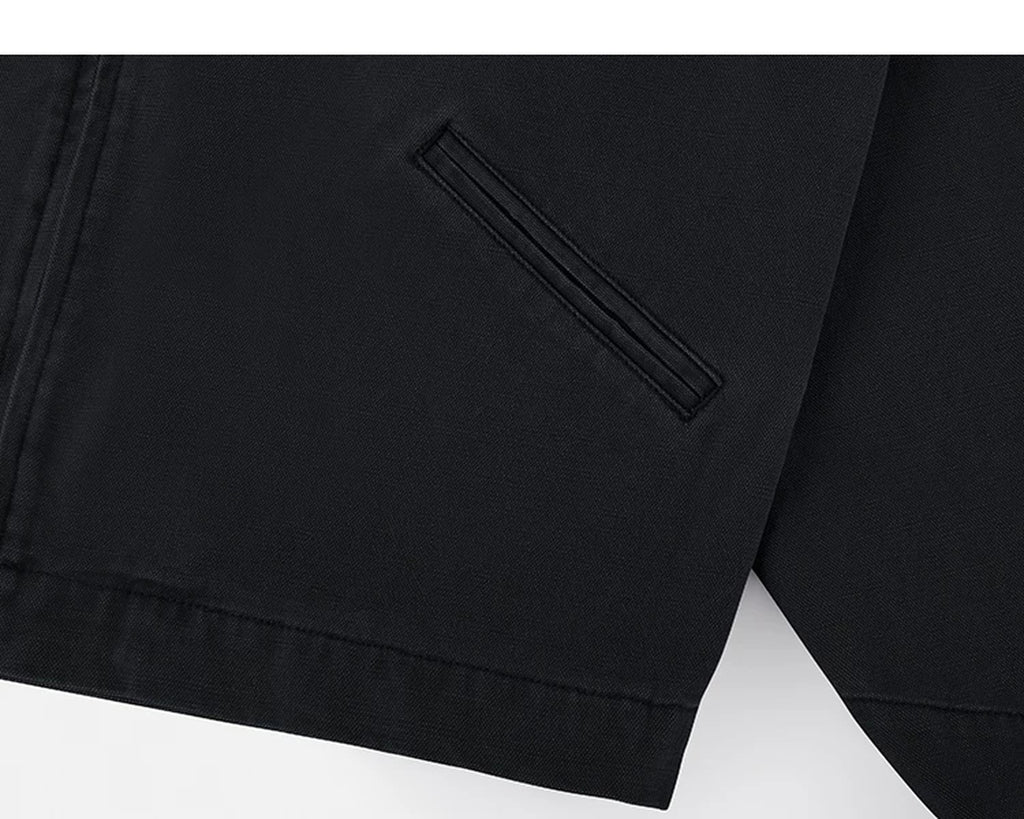 IDLT work jacket, black side pocket.