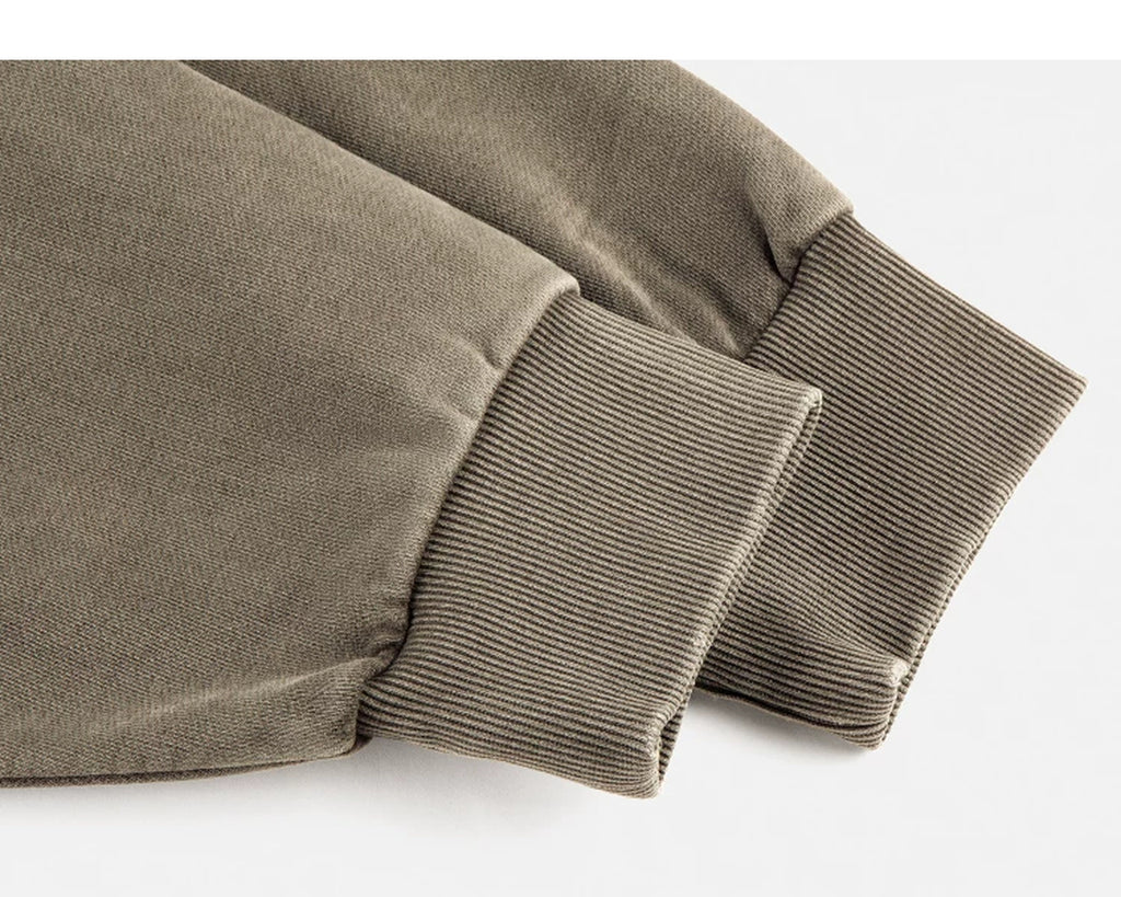 IDLT washed sweatshirt, olive ribbed cuffs.