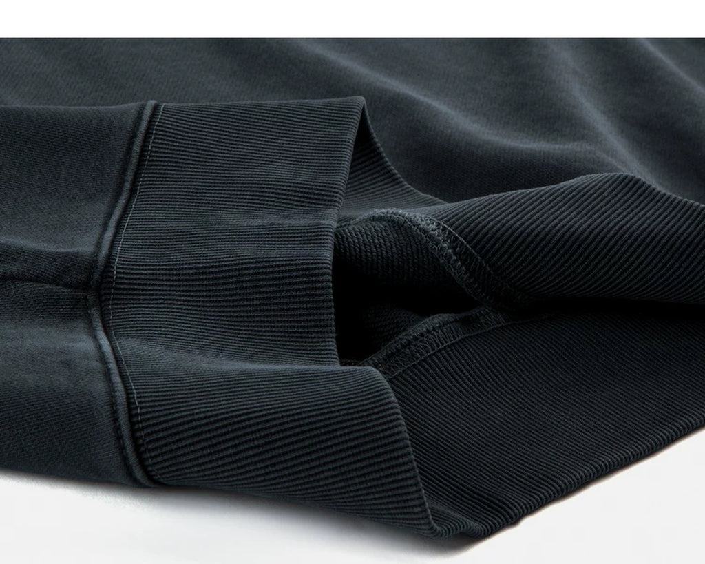 IDLT washed sweatshirt, dark gray folded hem.