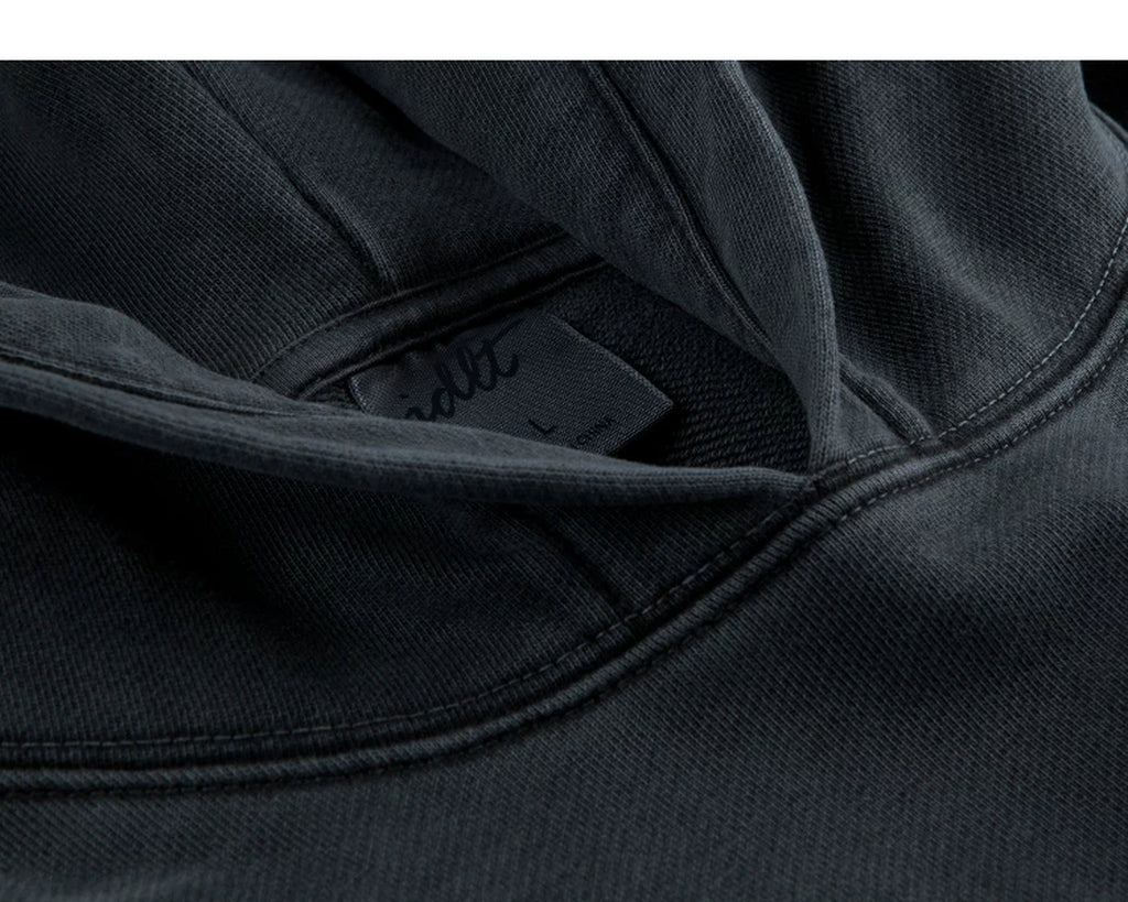 IDLT washed hoodie, dark gray neckline label.
