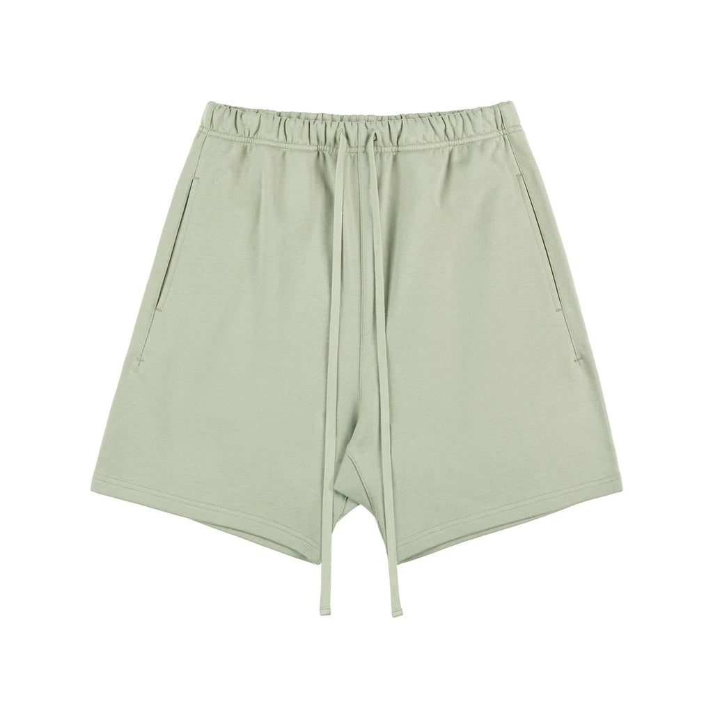IDLT sweat shorts, sage green front.