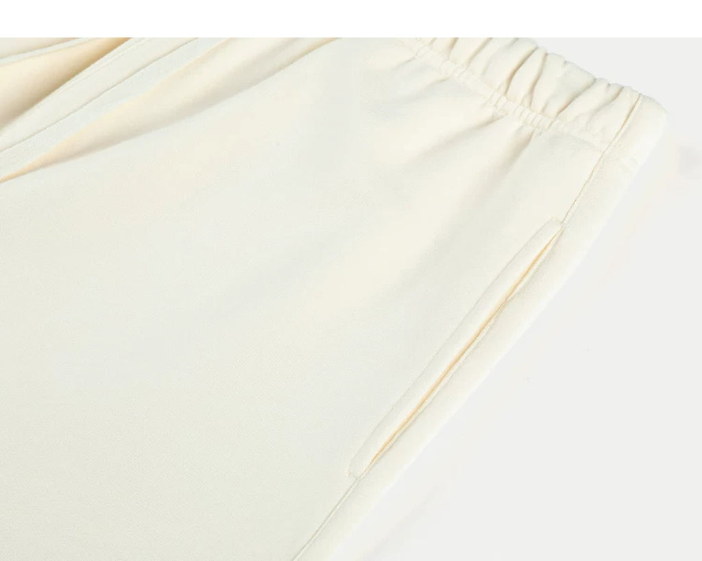 IDLT sweat shorts, cream side pocket.