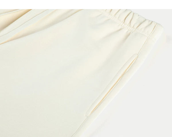 IDLT sweat shorts, cream side pocket.