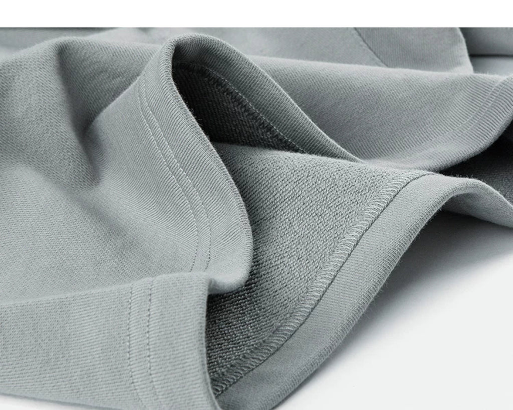 IDLT sweat shorts, light gray folded hem.
