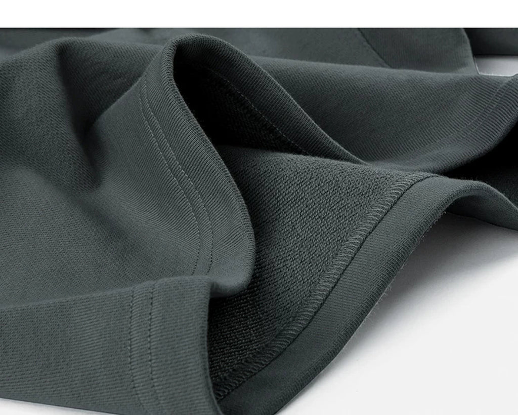 IDLT sweat shorts, dark gray folded hem.