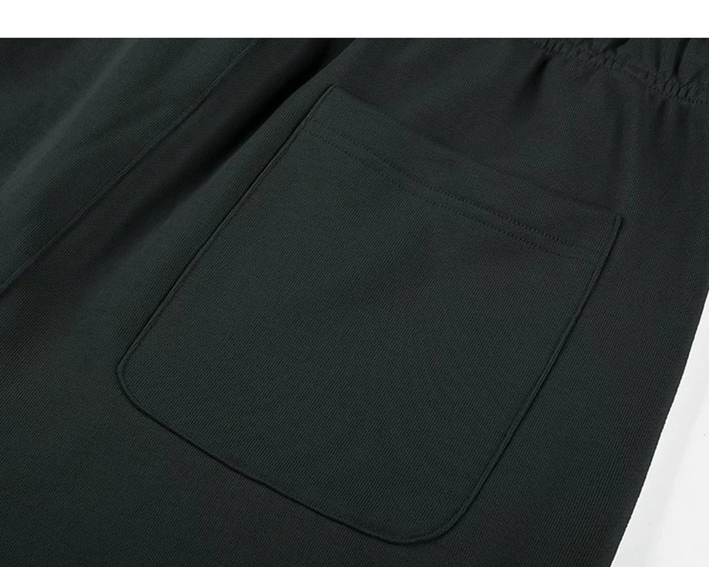 IDLT sweat shorts, black back pocket.