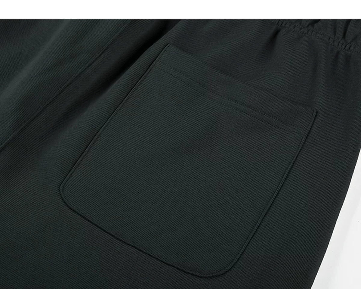 IDLT sweat shorts, black back pocket.