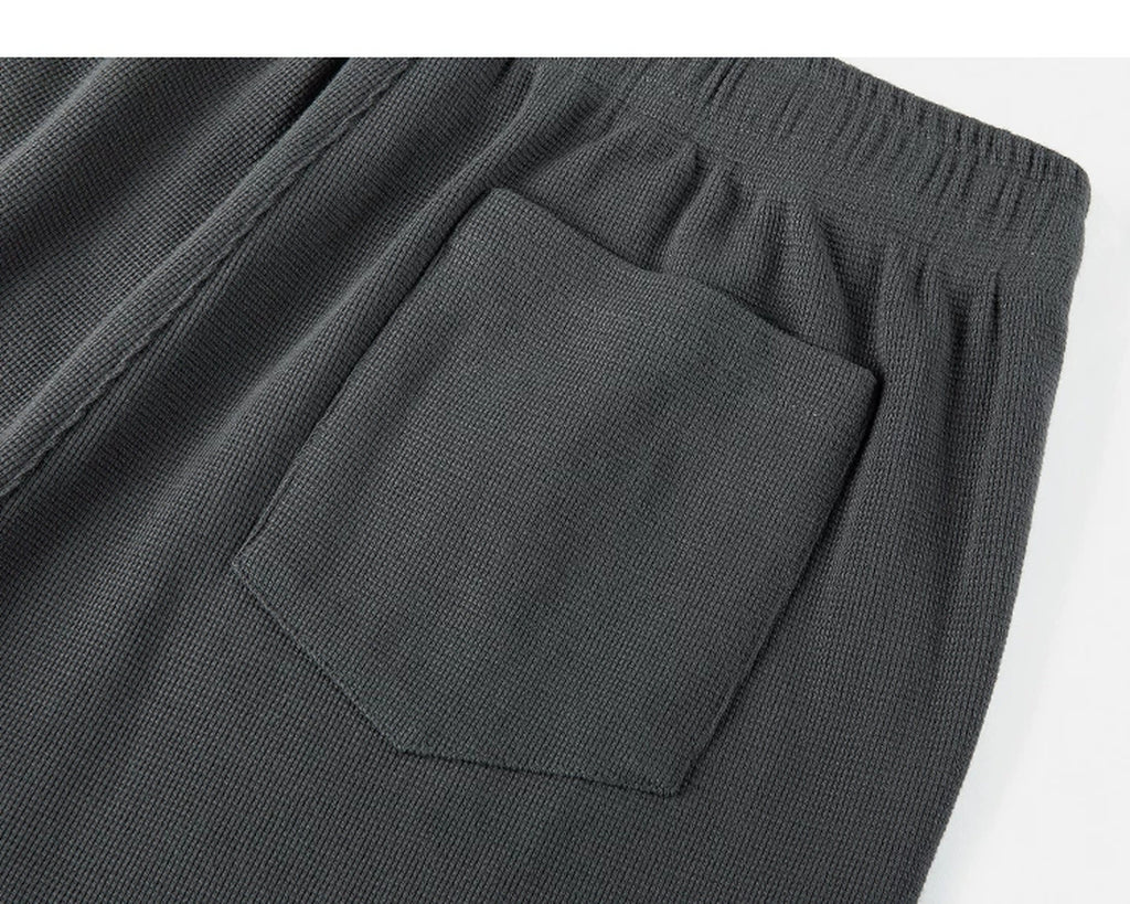 IDLT waffle sweatpants, dark gray back pocket close-up.