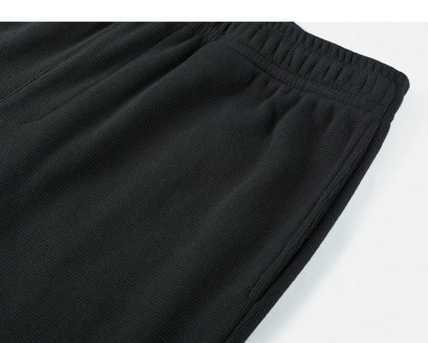 IDLT waffle sweatpants, black side pocket.