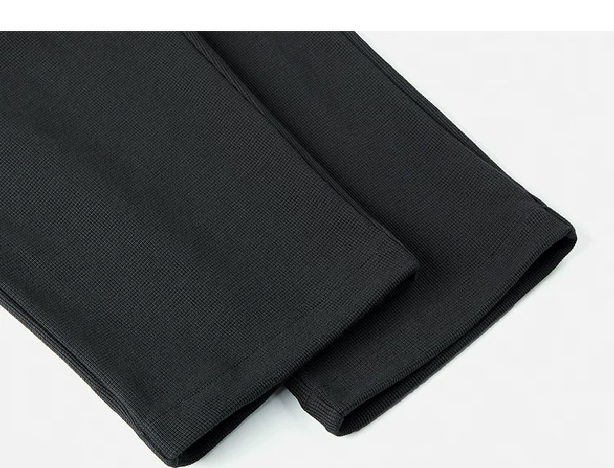 IDLT waffle sweatpants, black leg hems.