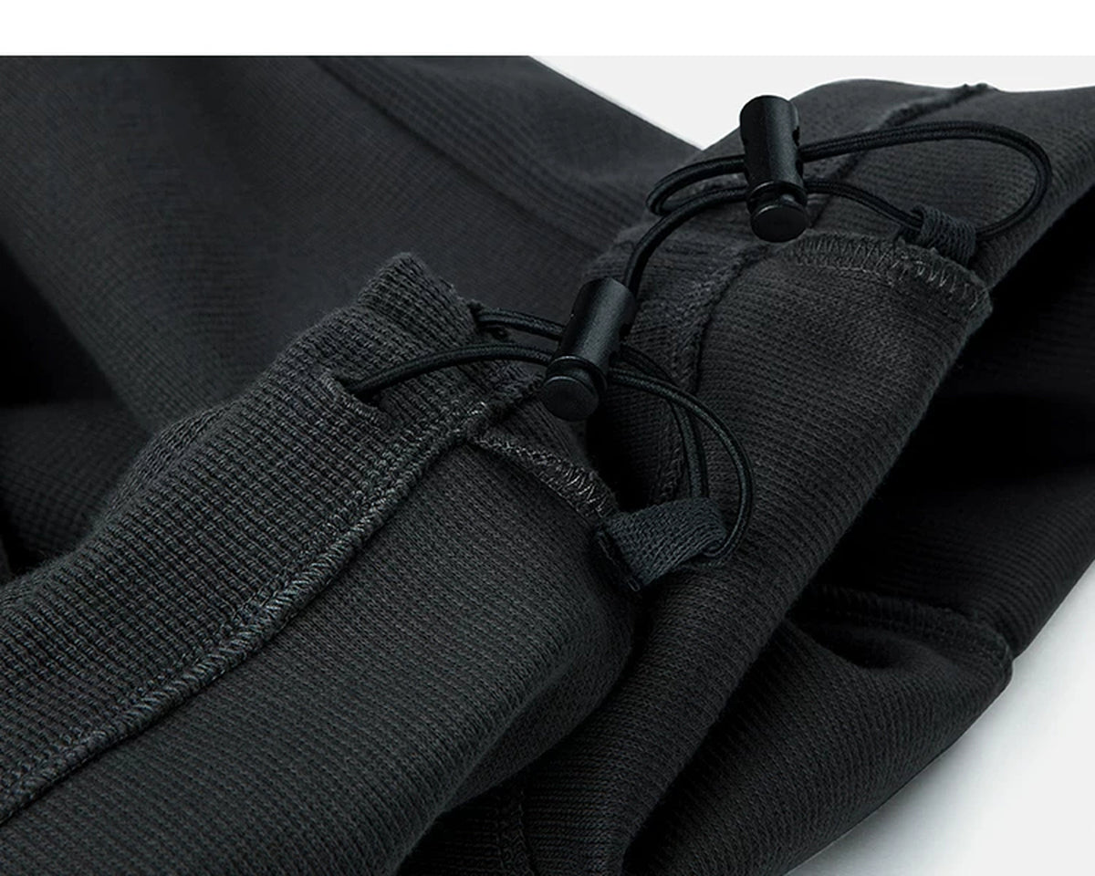 IDLT waffle sweatpants, black ankle drawcords.