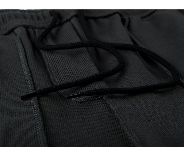 IDLT waffle sweatpants, black inner drawstring.