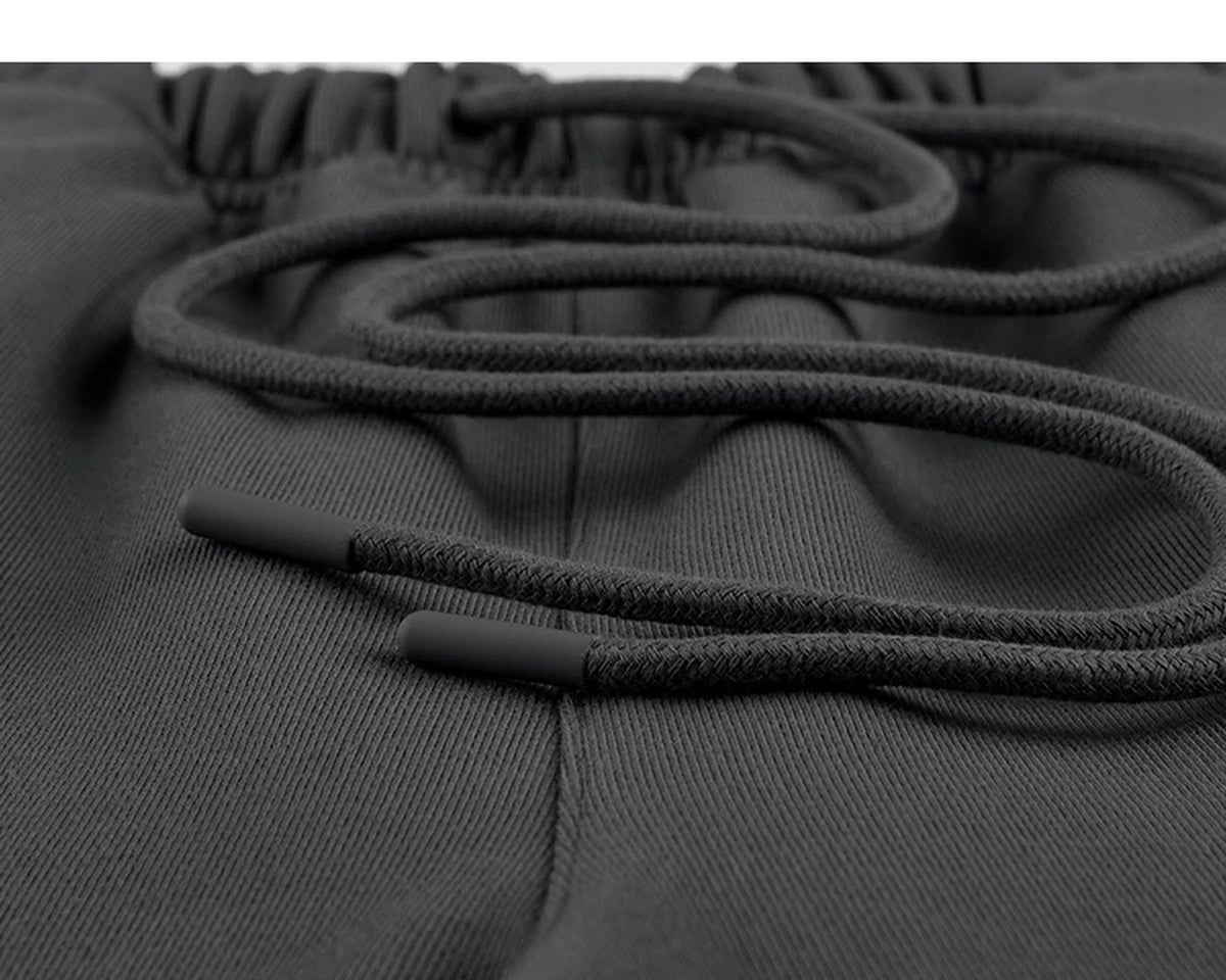 IDLT wide leg sweatpants, dark gray drawstring tips.