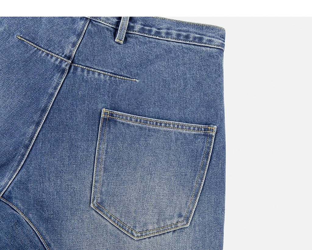 Washed Curved-Leg Jeans - COPPING THREADS - IDLT