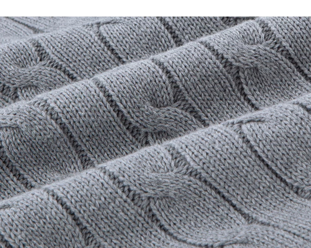 IDLT cable knit zip sweater, gray cable knit fabric folds.