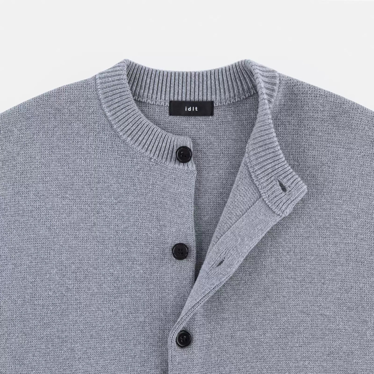 IDLT cardigan, gray open neckline close-up.